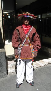 guy on sidewalk in cool hat