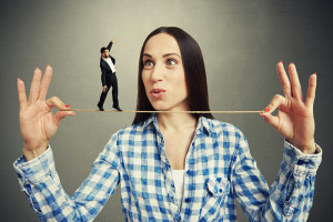 woman with man on a tightrope